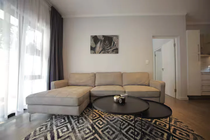 Bright furnished living room at The Monroe in Rosebank