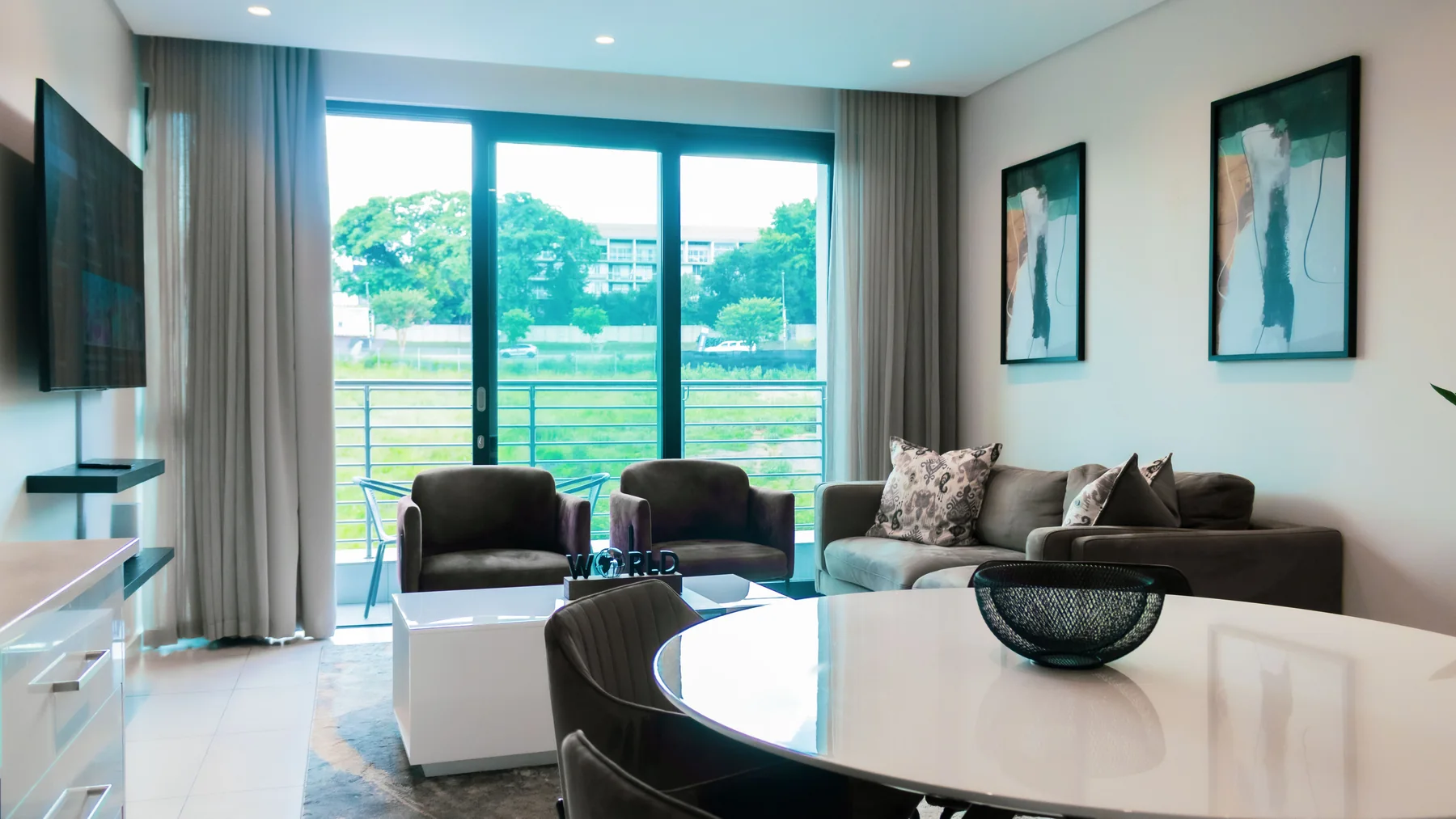 Open-plan furnished living and dining area in The Terrace Unit 113